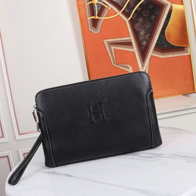 H**mes clutch bags